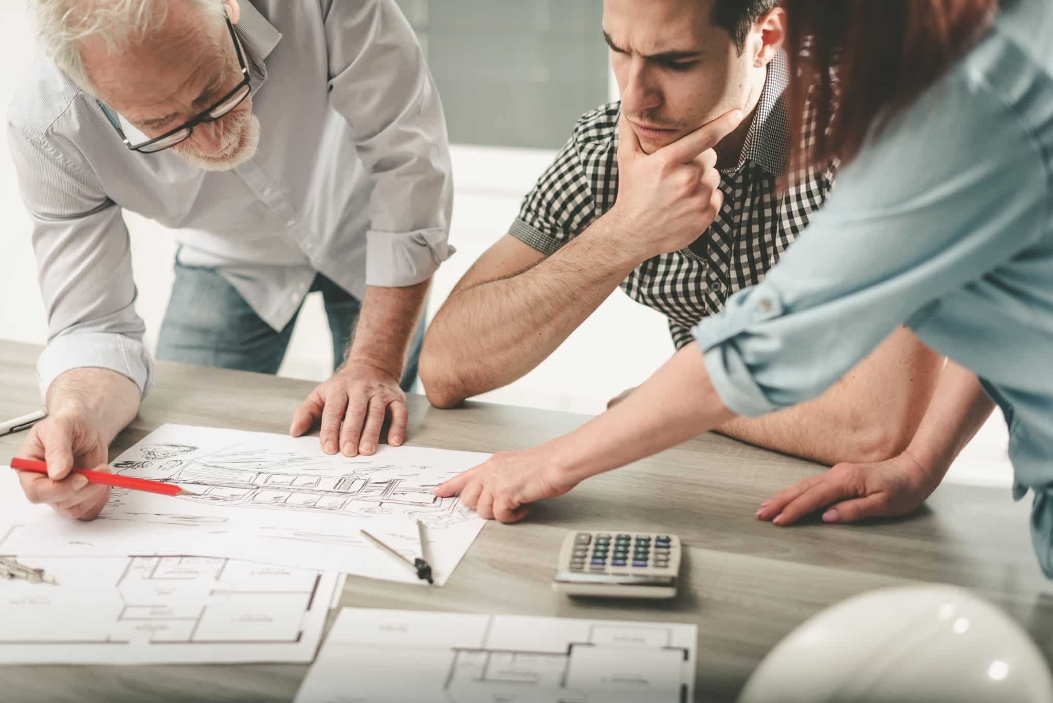 Architects working on plans at office